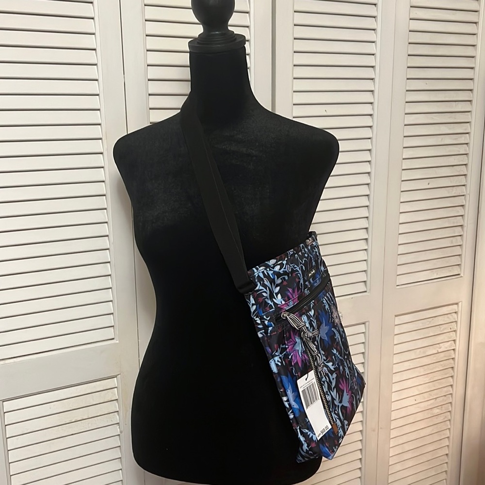 Vera Bradley cross body bag with matching wallet.